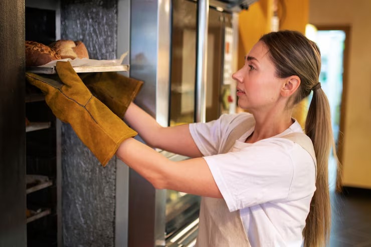 imgi_48_medium-shot-baker-holding-tray_23-2149233690