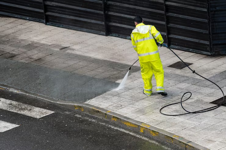imgi_48_worker-cleaning-sidewalk-with-pressurized-water-maintenance-cleaning-concept_136875-886